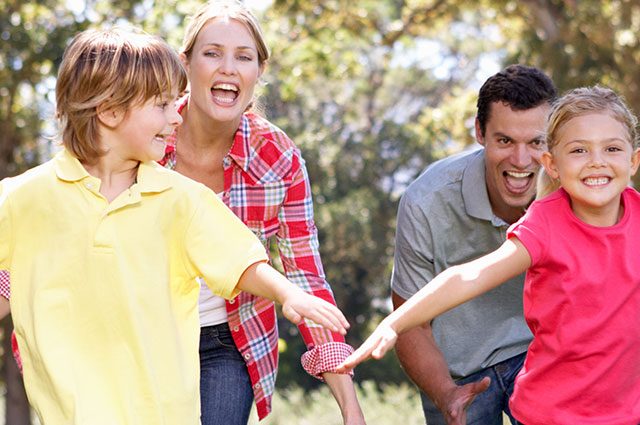 parents playing outside with kids
